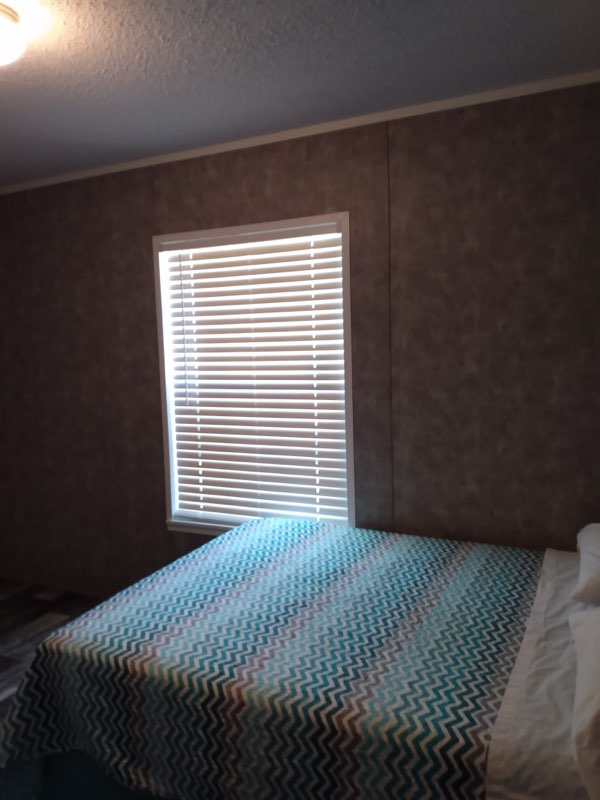 a bedroom at lake point motel